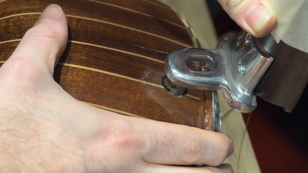 Converting a Turkish cumbus plucked instrument into a bowed tanbur