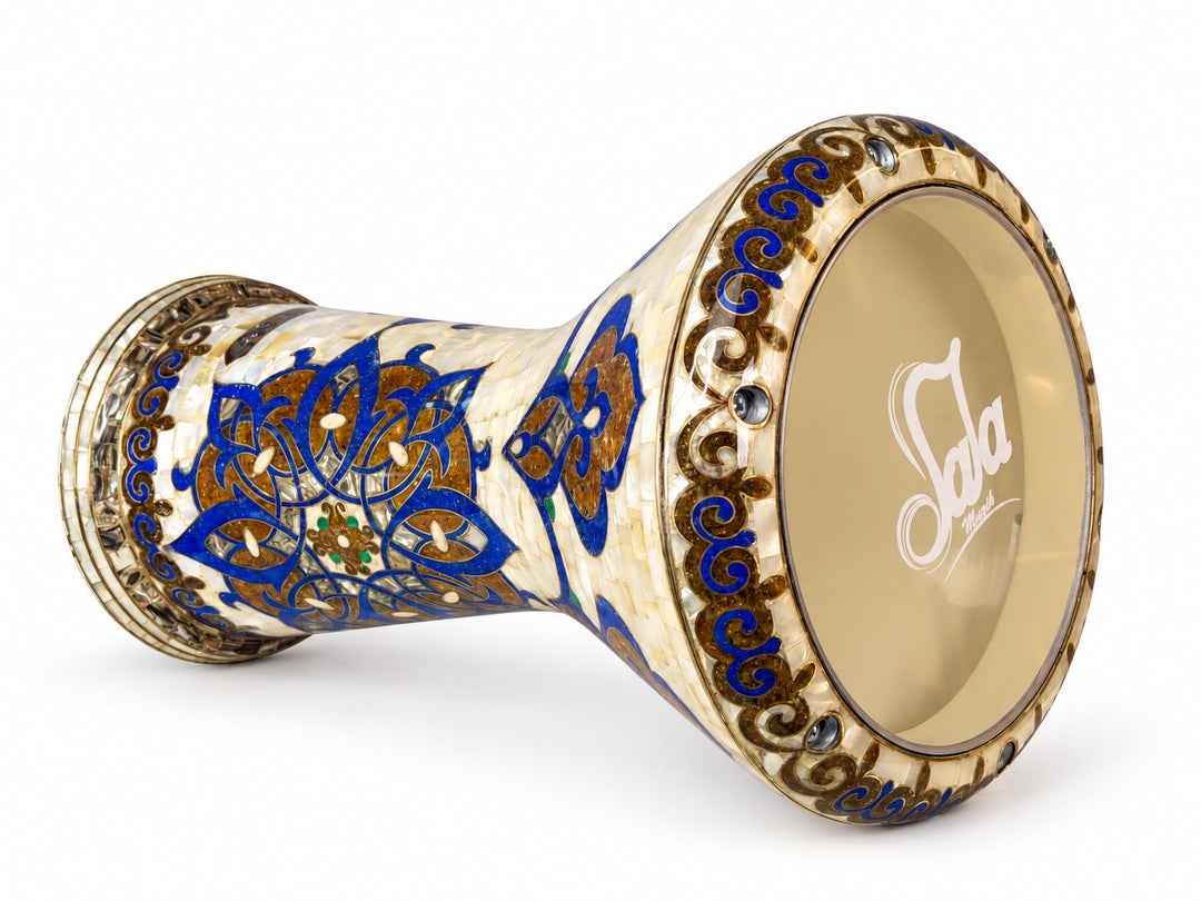 Sala Azure Arabesque Sombaty darbuka on its side, showing the Sala-branded drumhead and cobalt-blue and gold-toned floral mosaic on an ivory background.